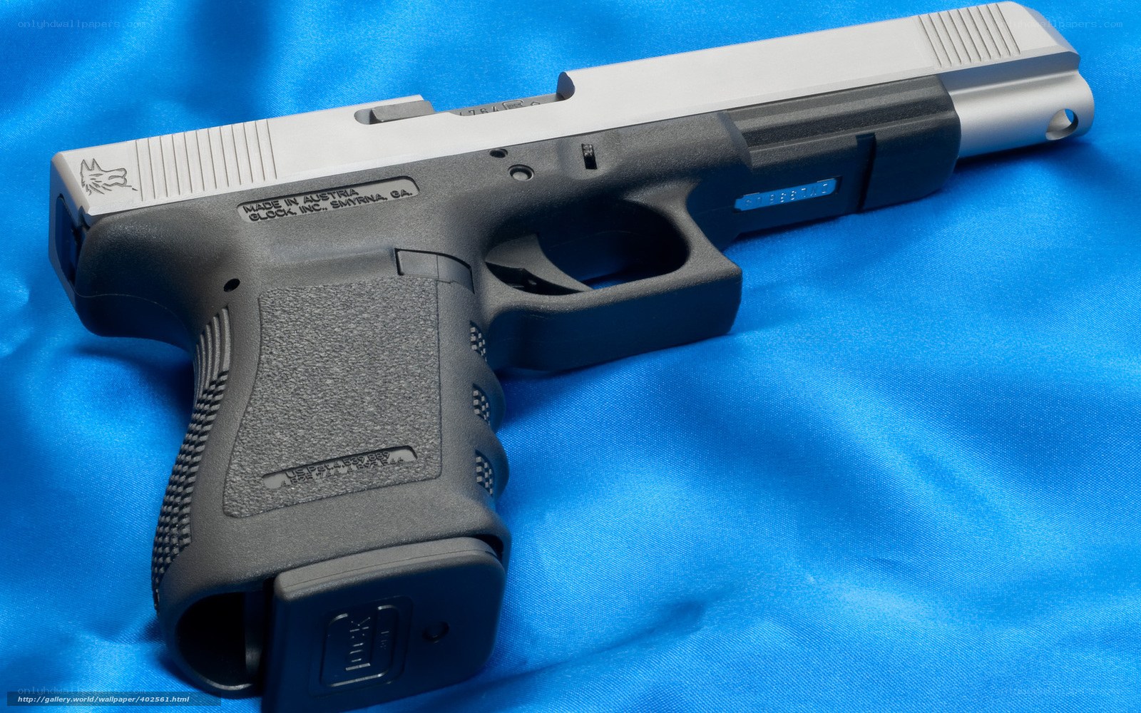 Glock 17 pistol on blue cloth