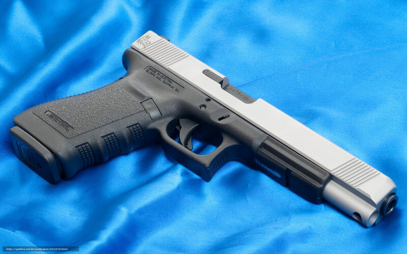 Glock 17 pistol on blue fabric
