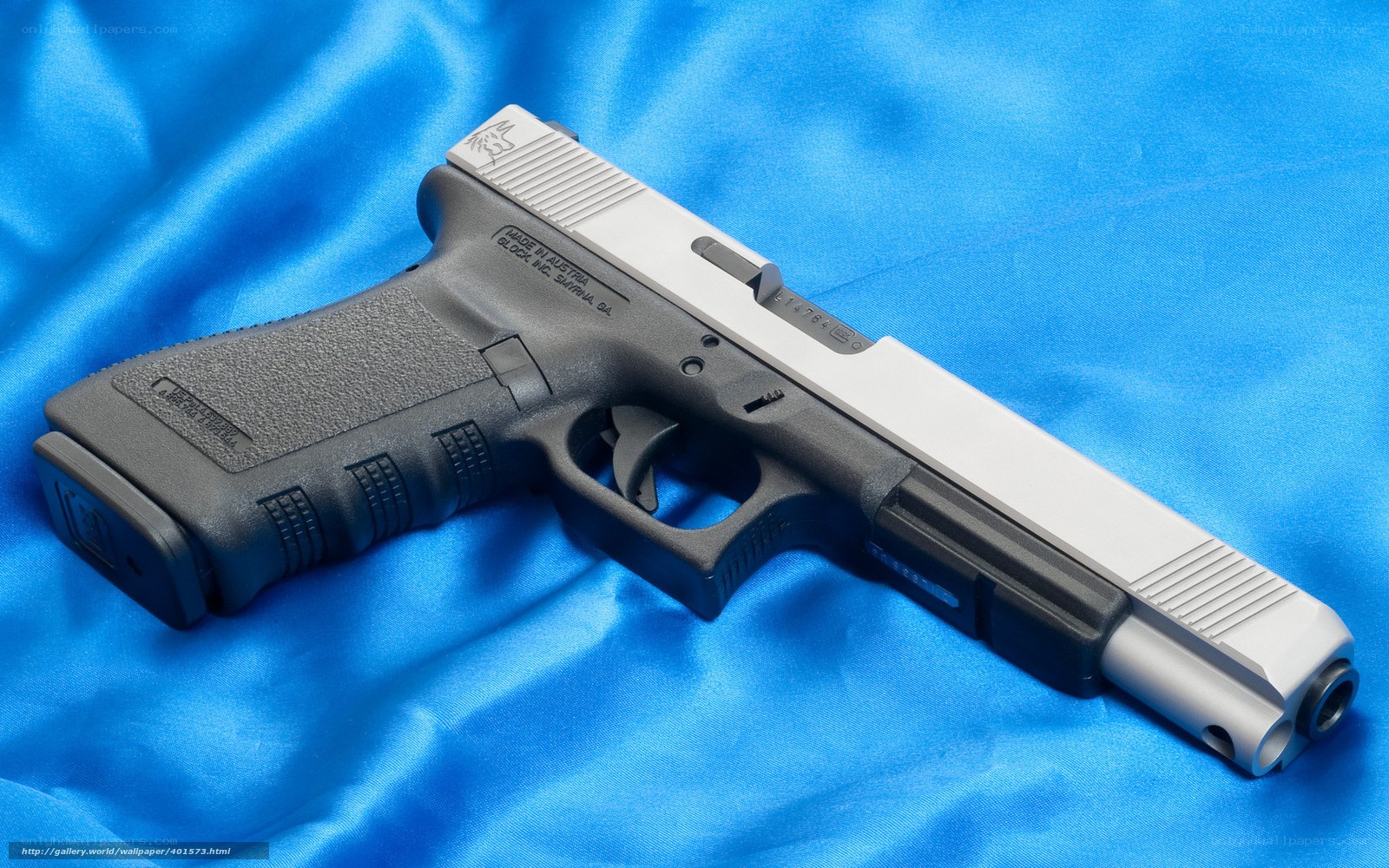 Glock 17 pistol on blue fabric