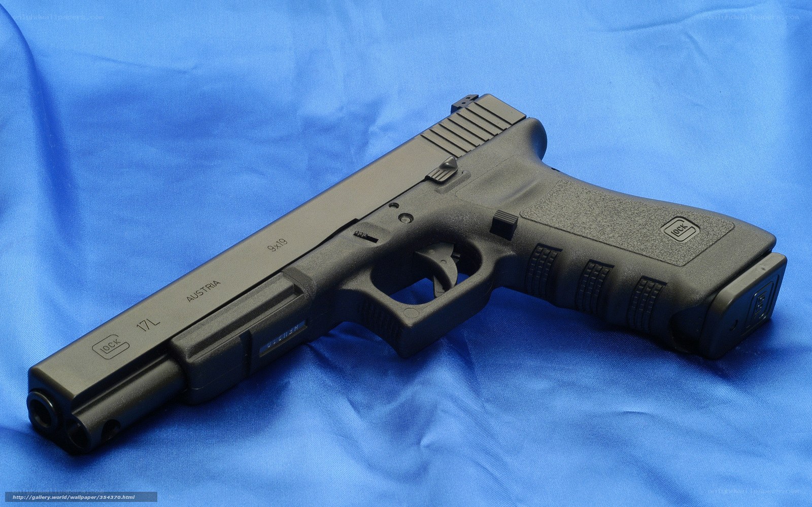 Glock 17L pistol on blue cloth