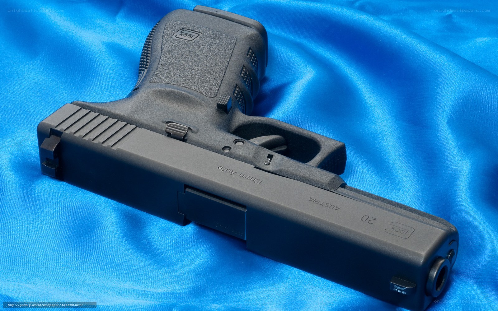 Glock 20 pistol on blue fabric