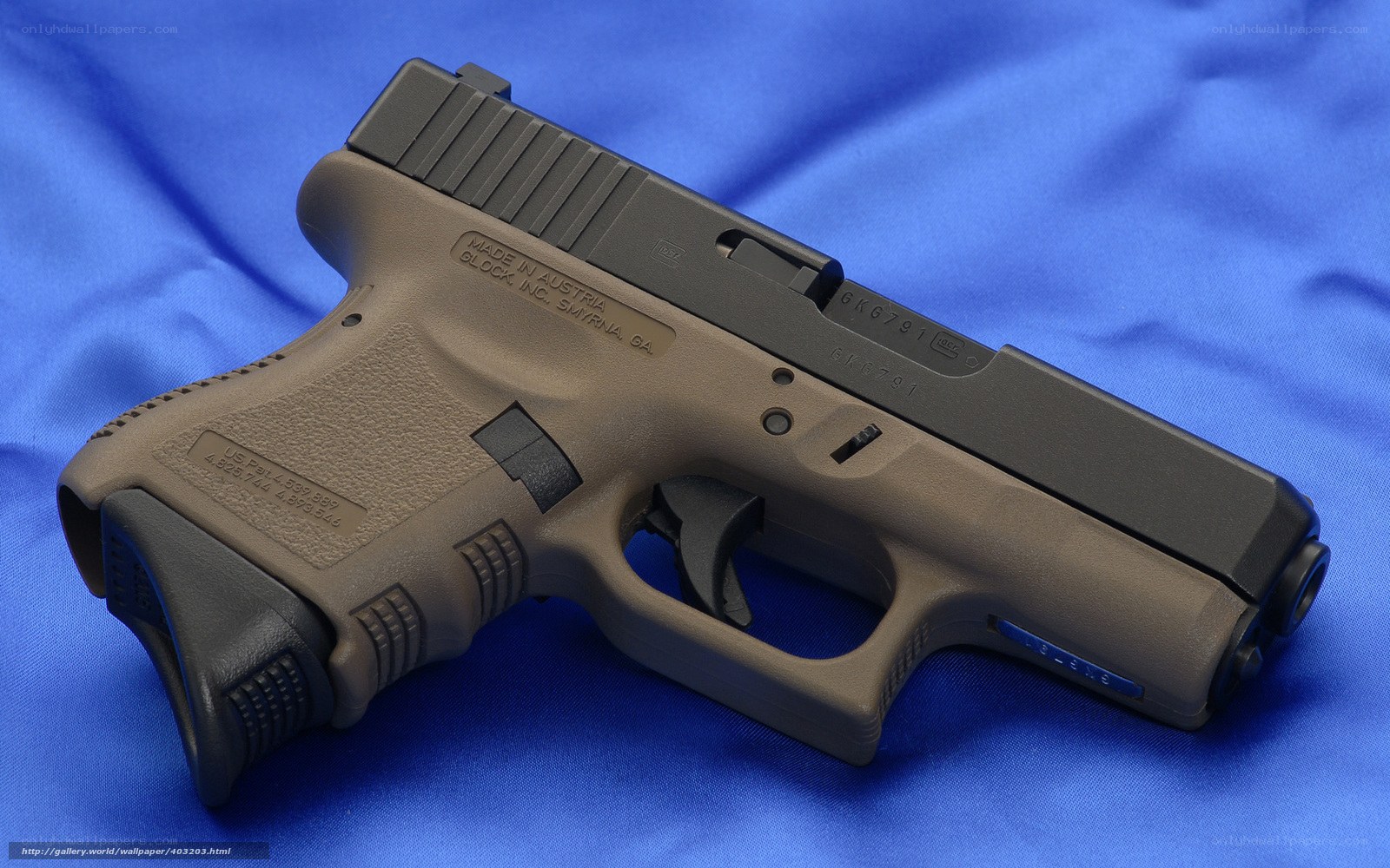 Glock 26 pistol on blue cloth