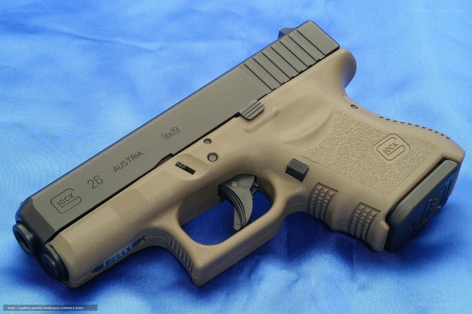 Glock 26 pistol on blue cloth