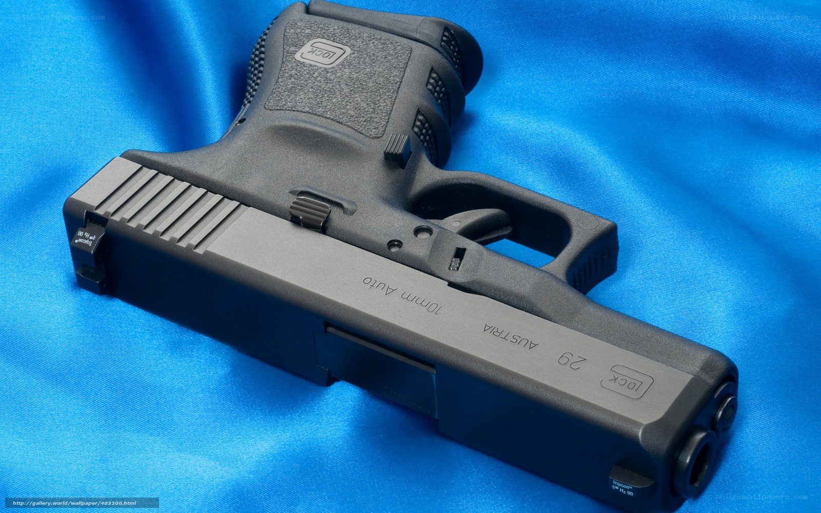 Glock 29 pistol on blue fabric