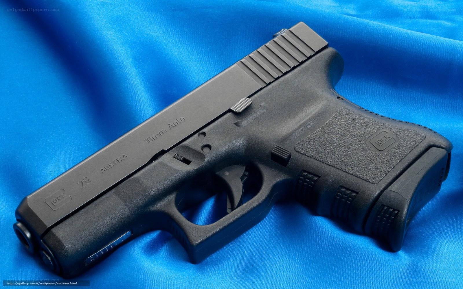 Glock 29 pistol on blue fabric
