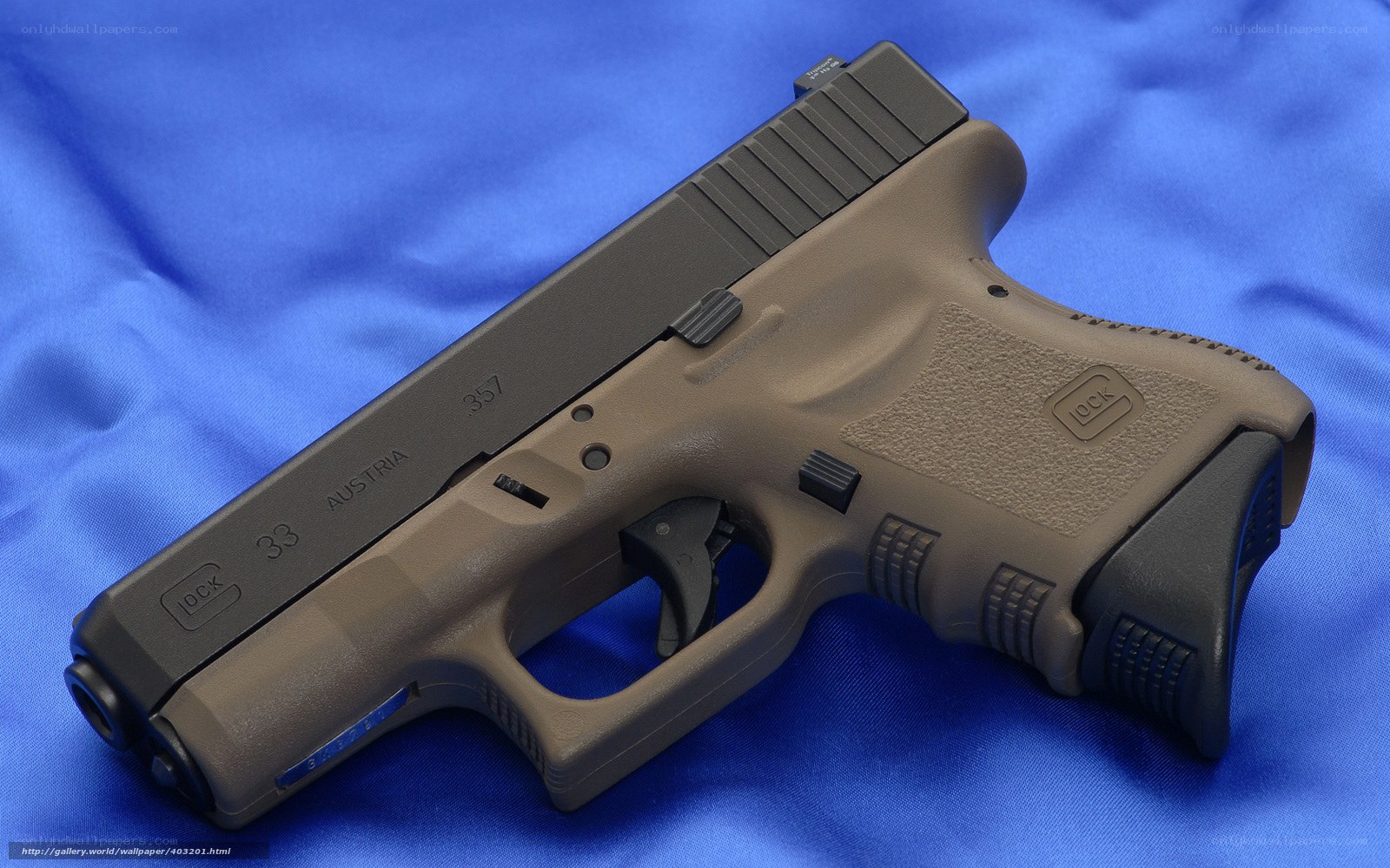 Glock 33 pistol on blue cloth