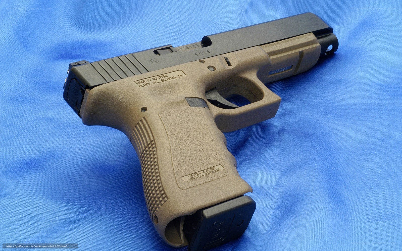 Glock 581 pistol on blue cloth
