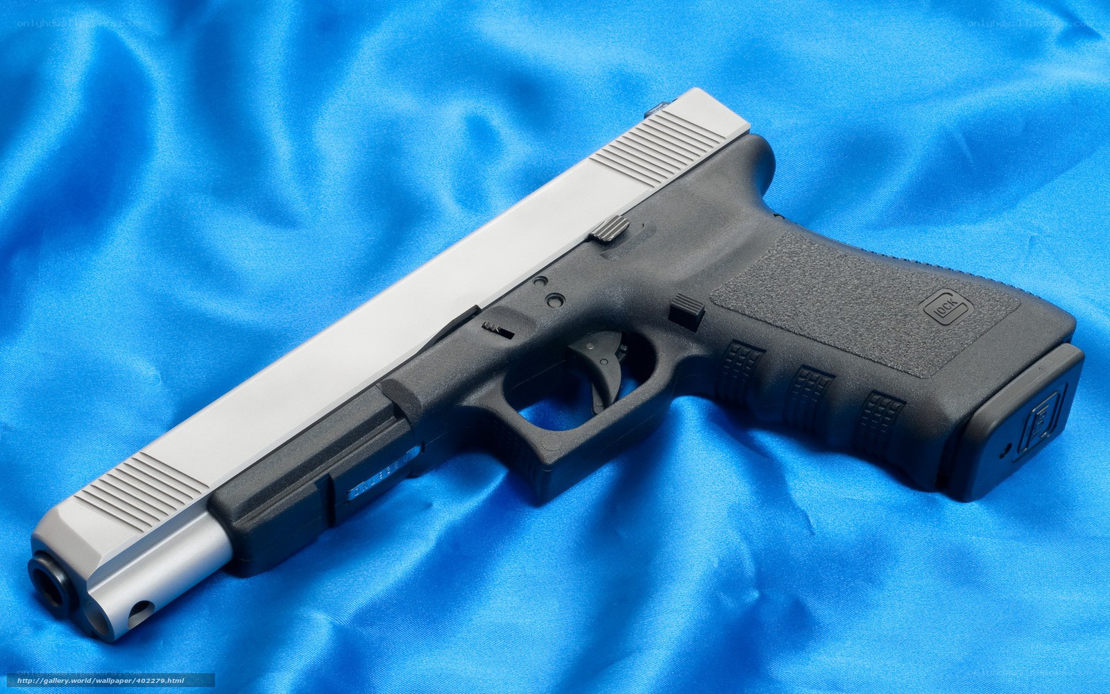 Glock pistol on blue fabric