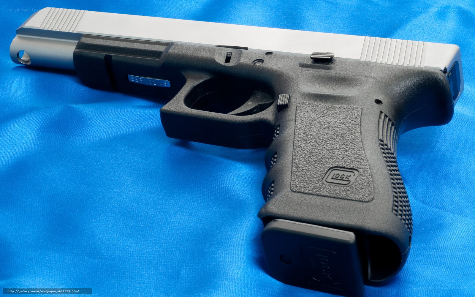 Glock pistol on blue fabric