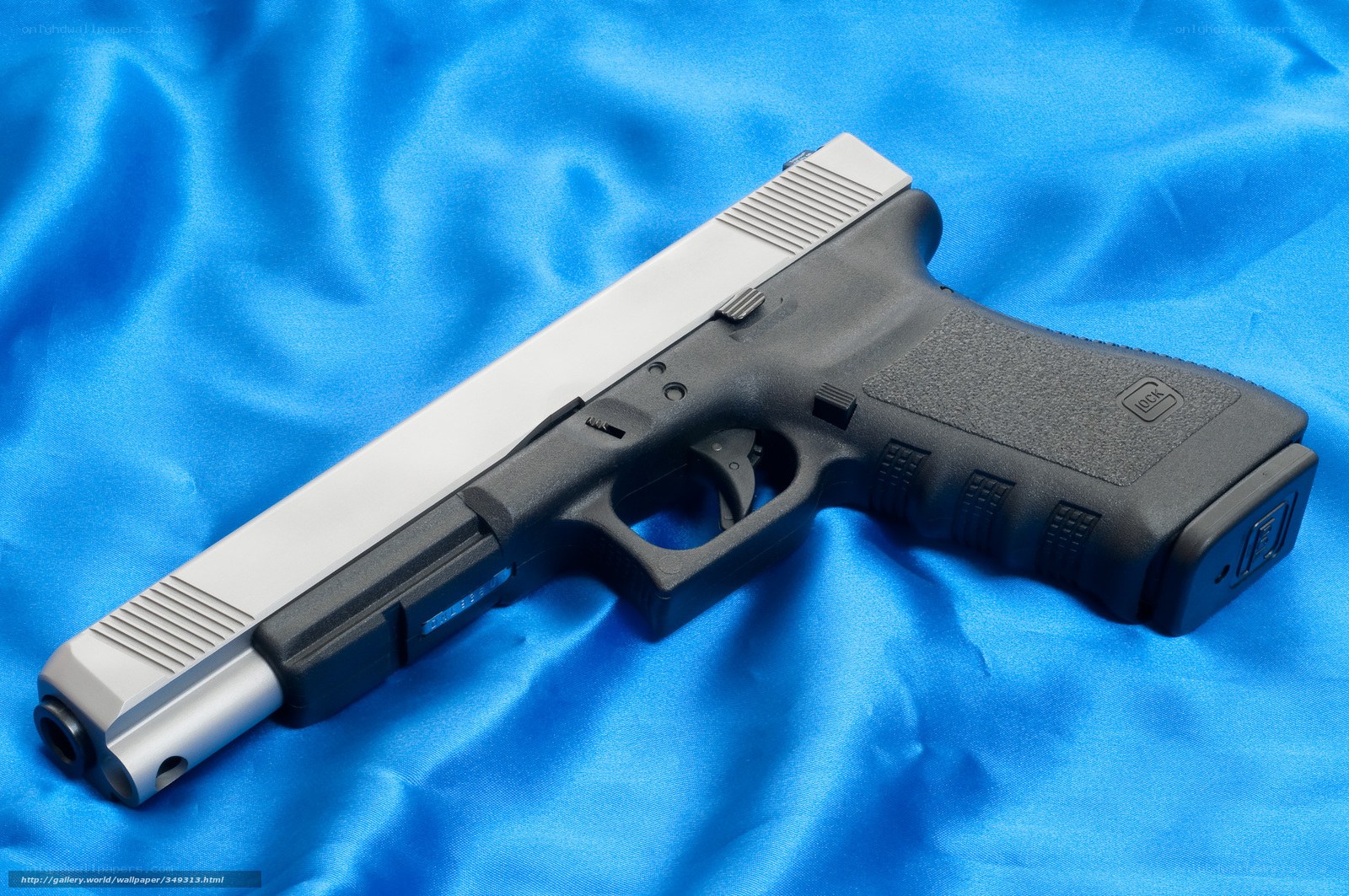 Glock pistol on blue fabric