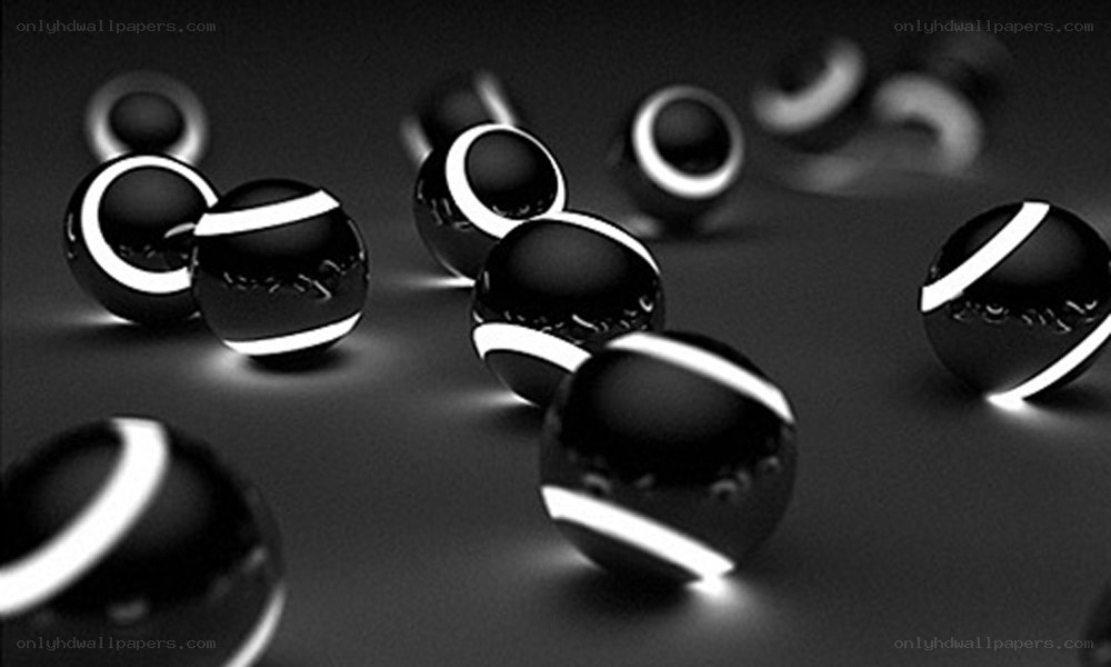 Glossy black spheres with white rings