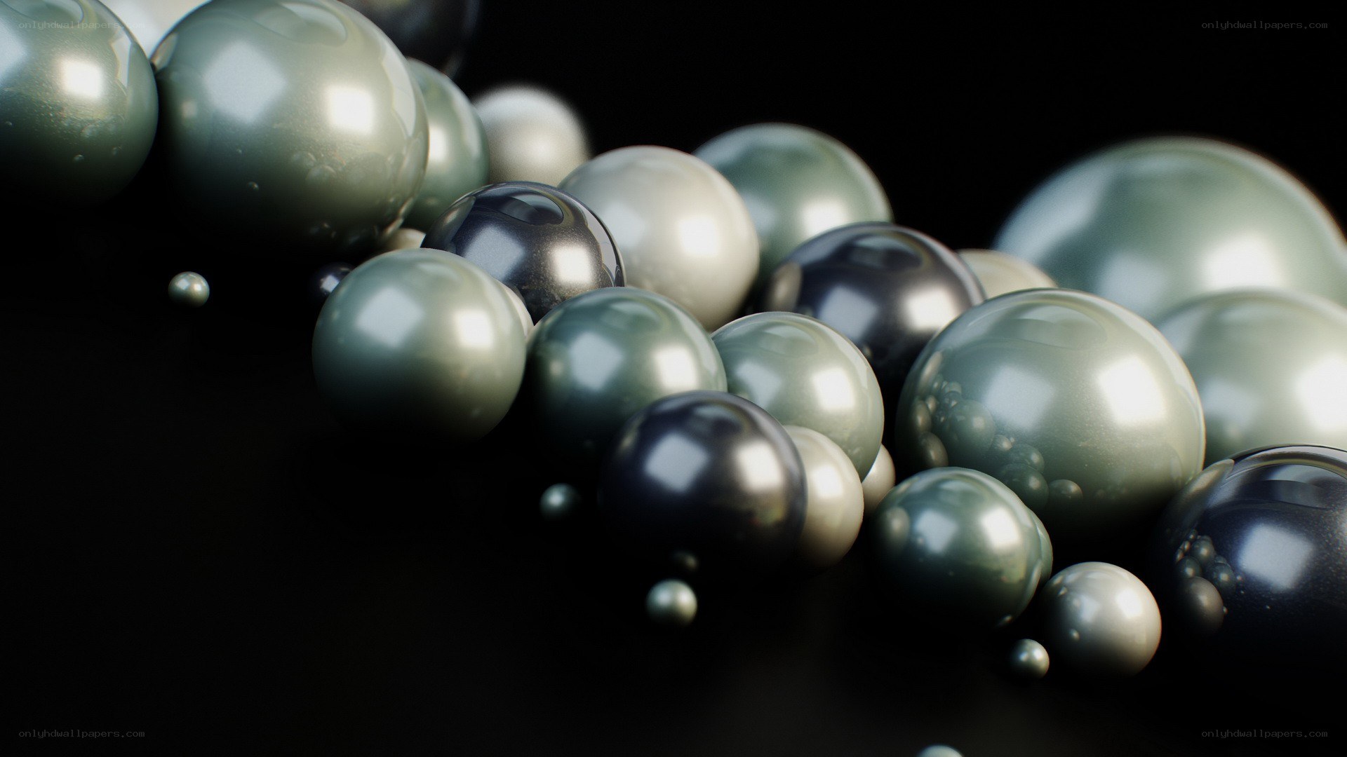 Glossy spheres on black background