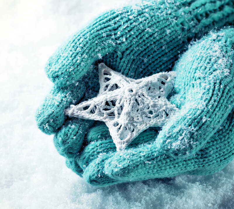 Gloved Hands Holding Star
