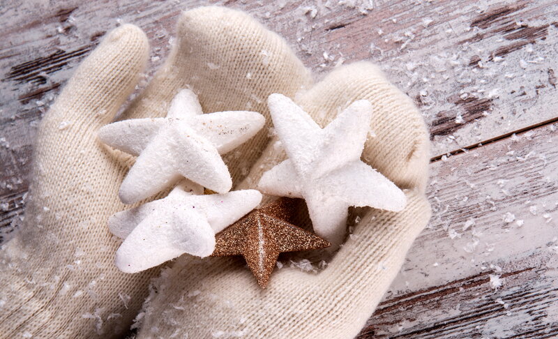 Gloved Hands Holding Stars