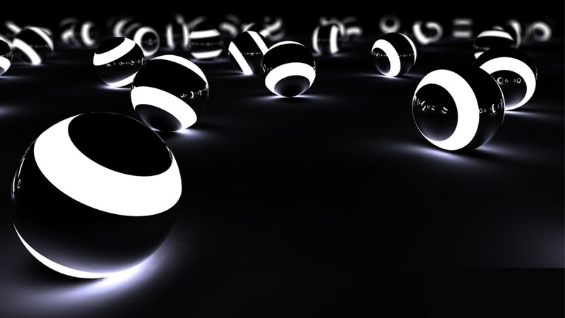 glowing black and white spheres