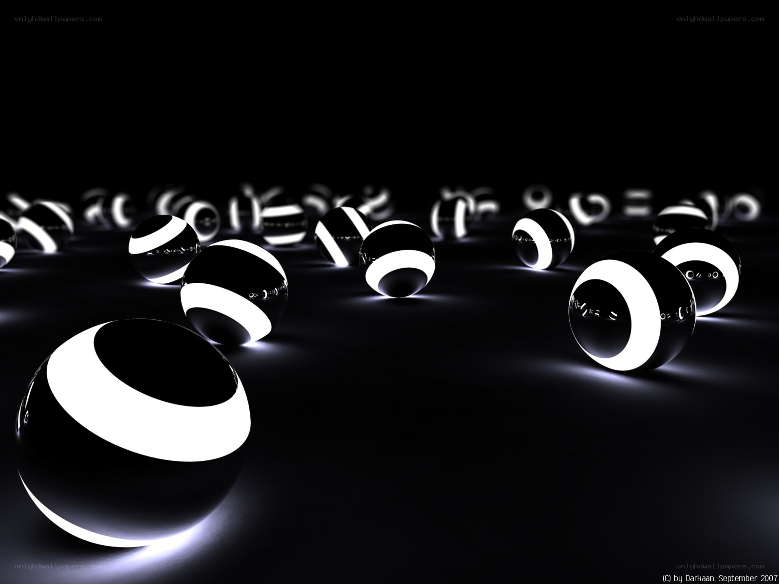 Glowing black and white spheres