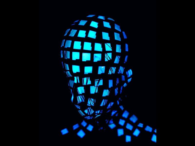 glowing blue cube head sculpture