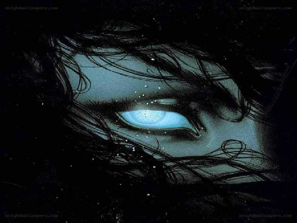 glowing blue eye in darkness