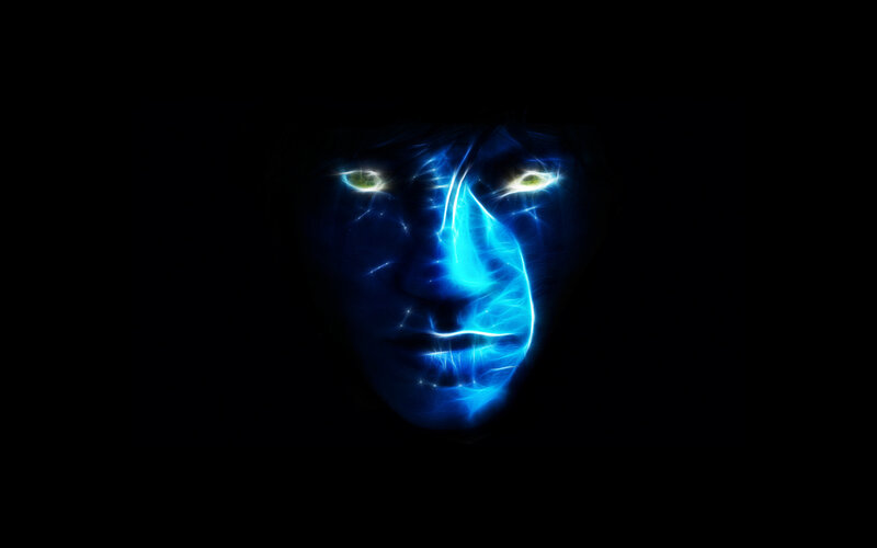 glowing blue face in darkness