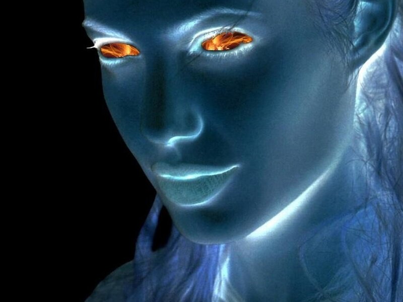 glowing blue figure with fiery eyes