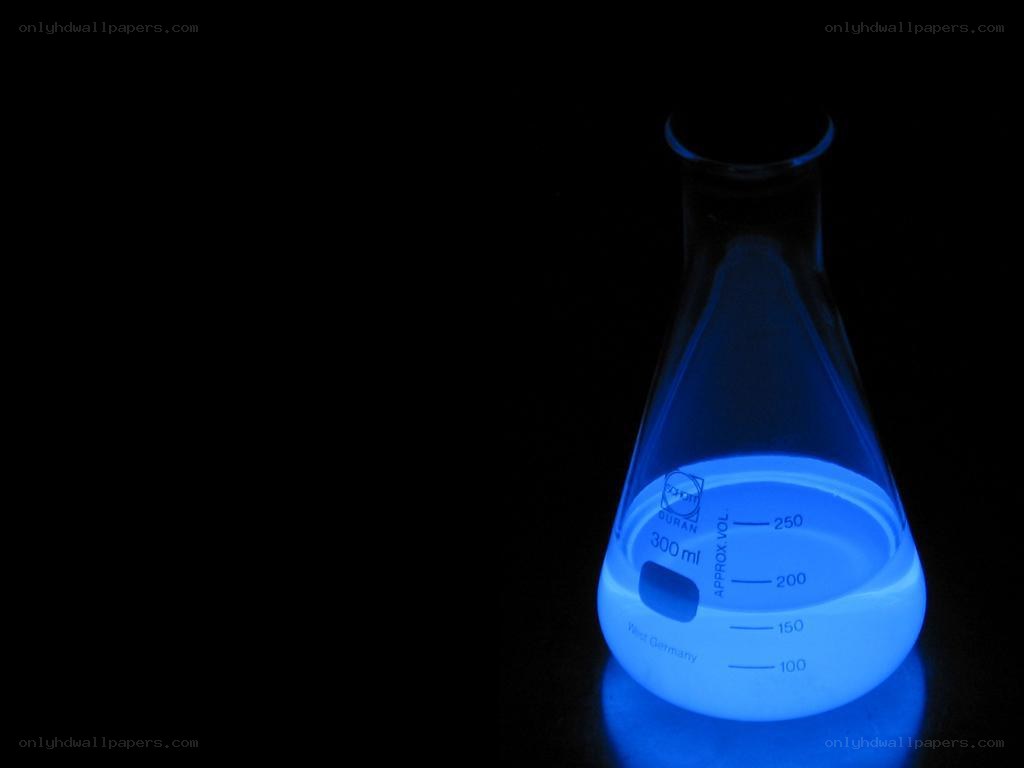 glowing blue liquid in flask