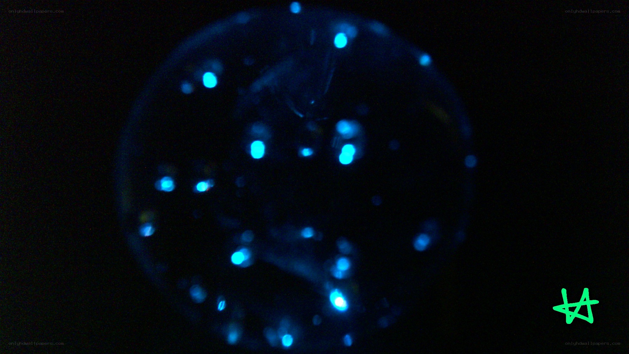 glowing blue sphere with green mark