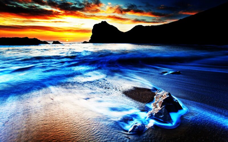 Glowing Blue Waves at Beach