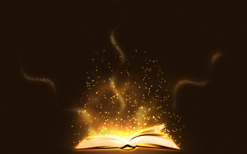glowing book with magical text