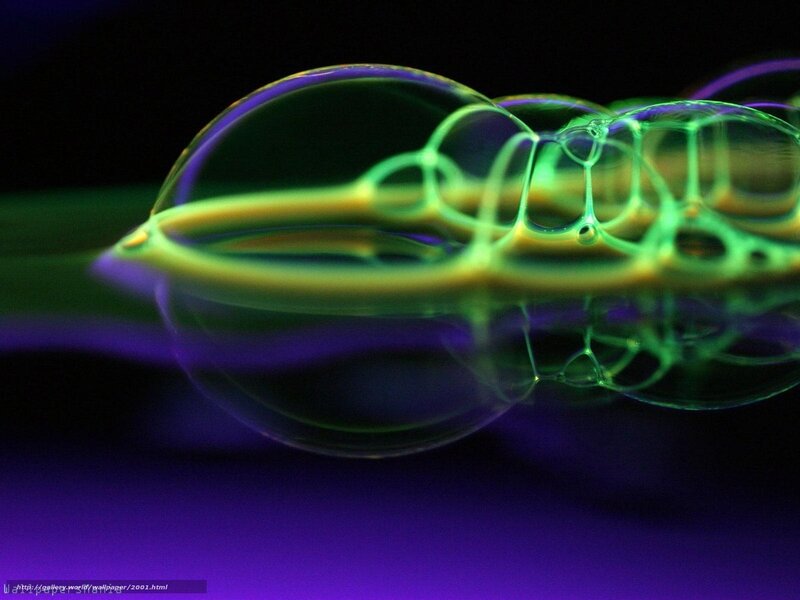 Glowing bubbles on dark surface