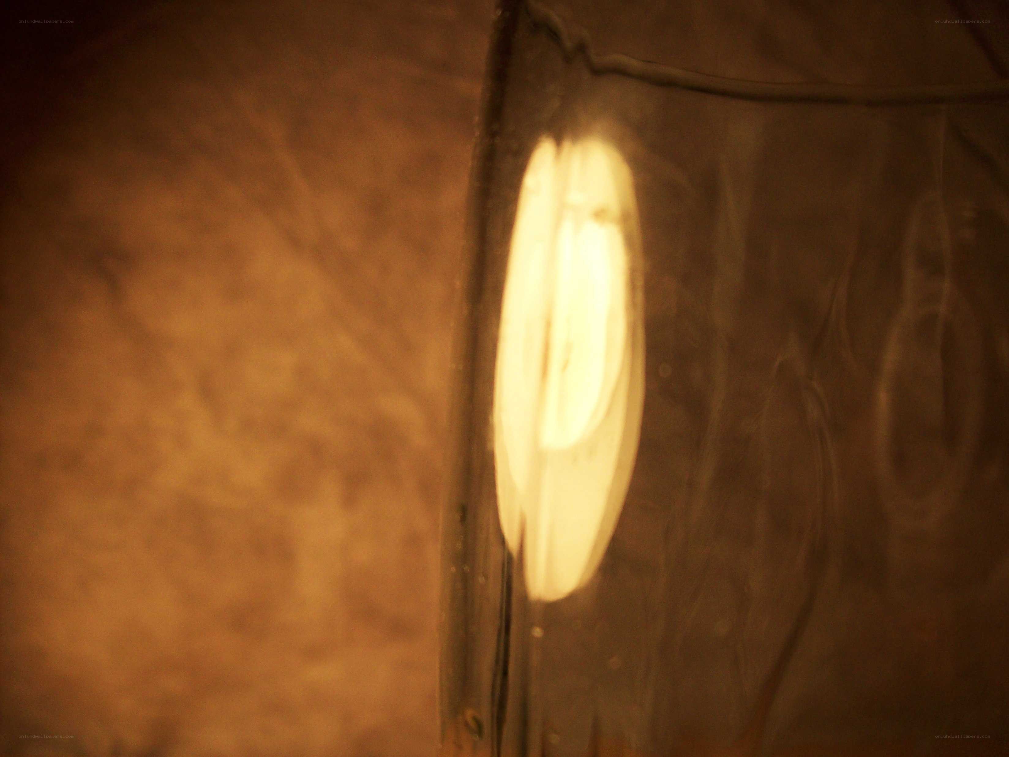 glowing bulb in glass jar