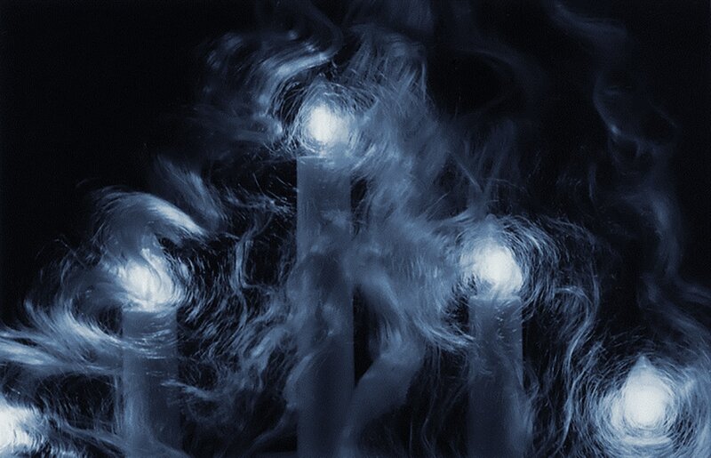 Glowing Candles in Smoke