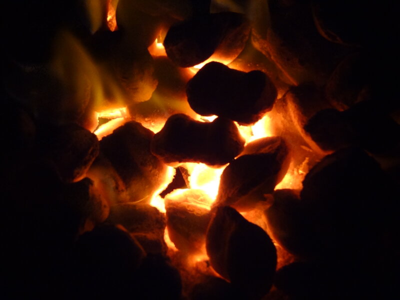 Glowing Charcoal Briquettes — Orange