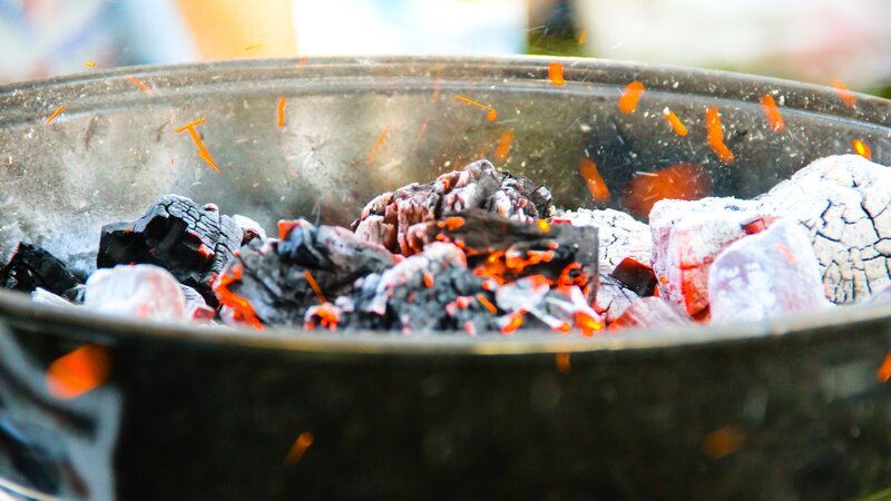 glowing charcoal in a grill