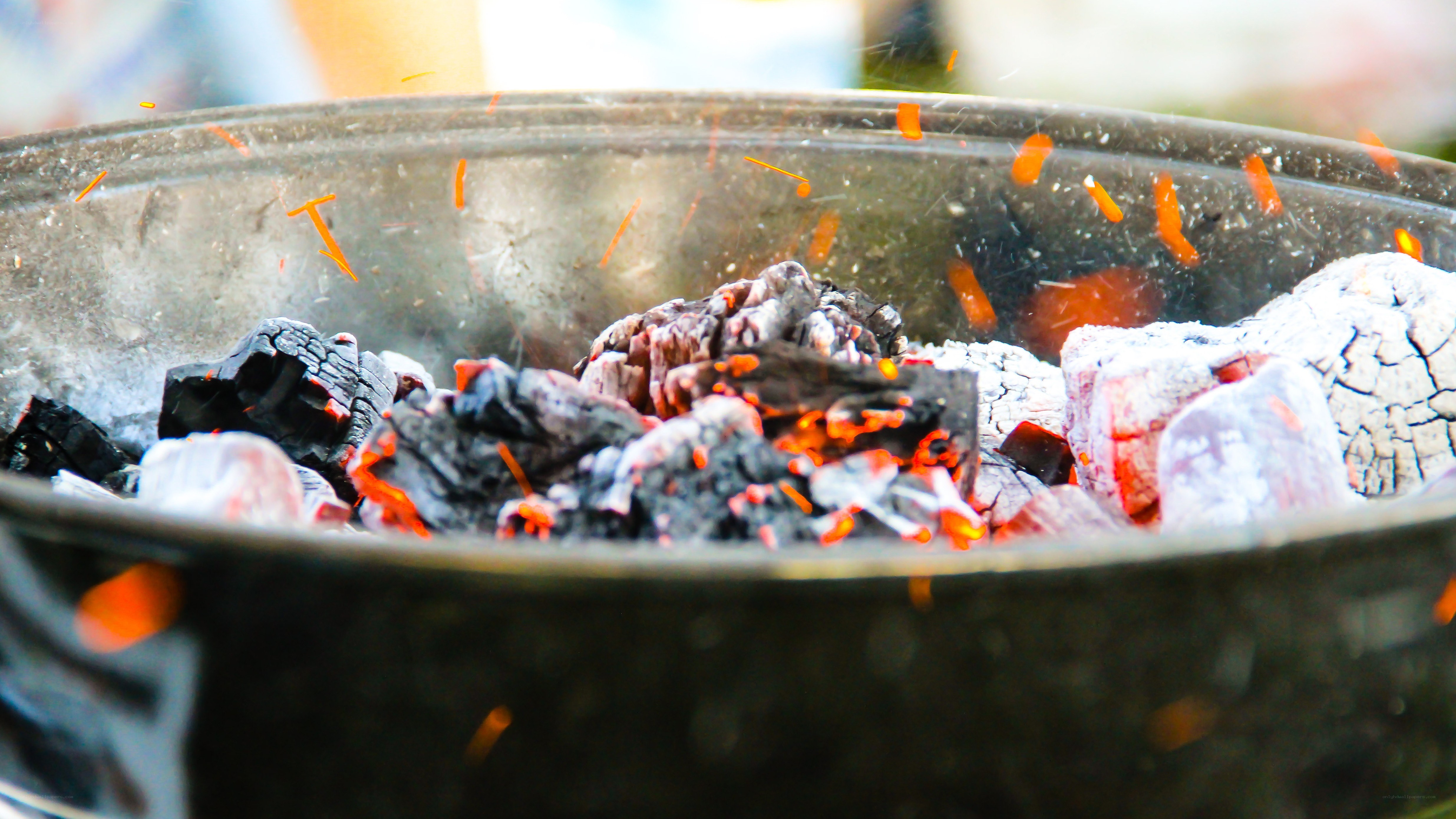 glowing charcoal in a grill