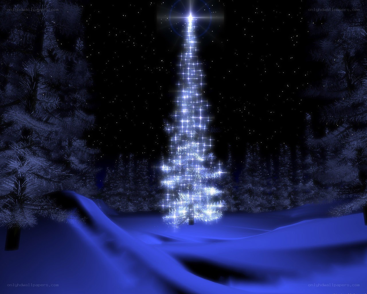 glowing christmas tree in snow