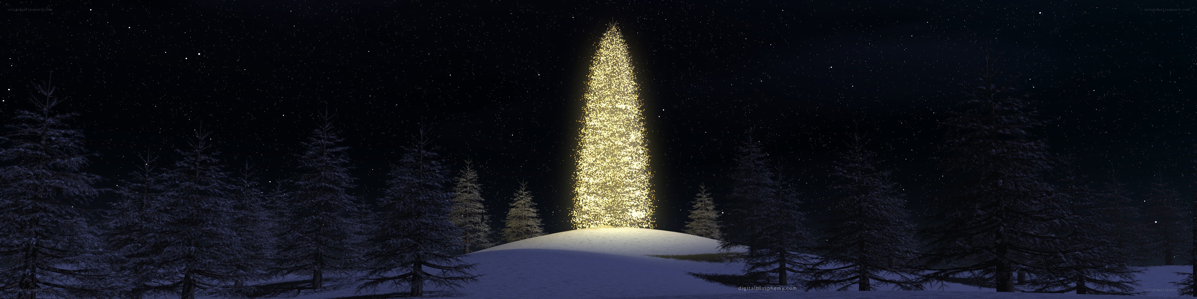 glowing christmas tree in snow