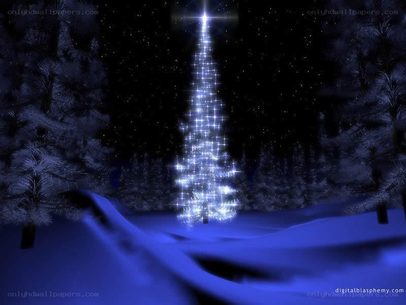 glowing christmas tree in snow