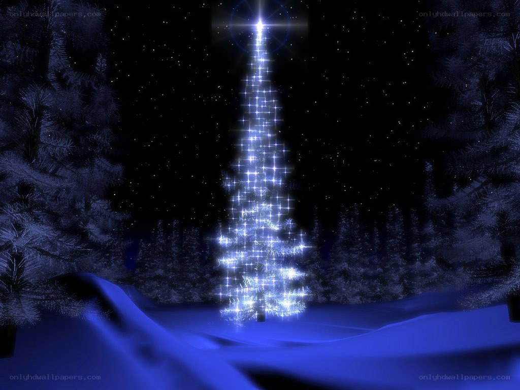 glowing christmas tree in snow