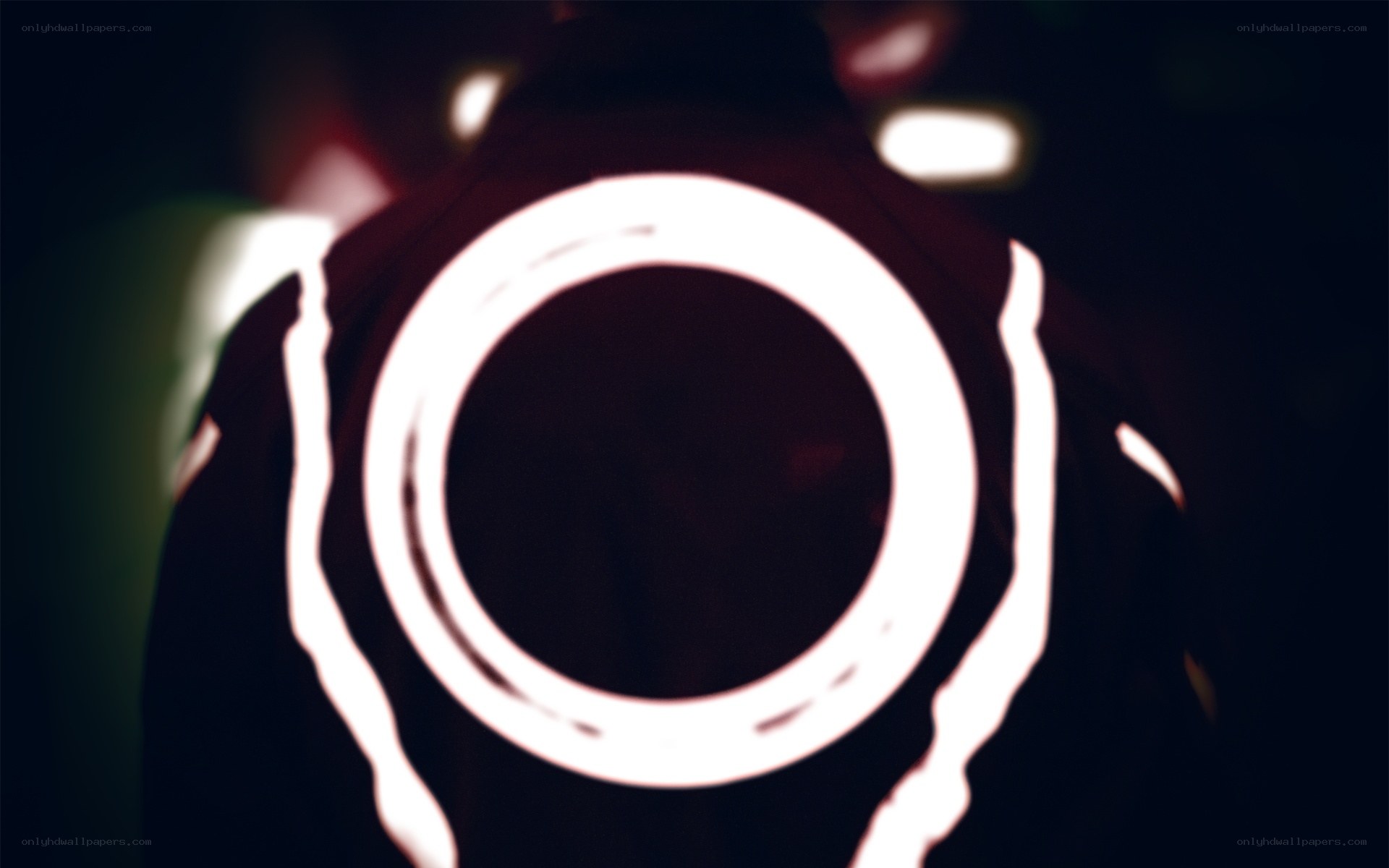glowing circle on dark jacket