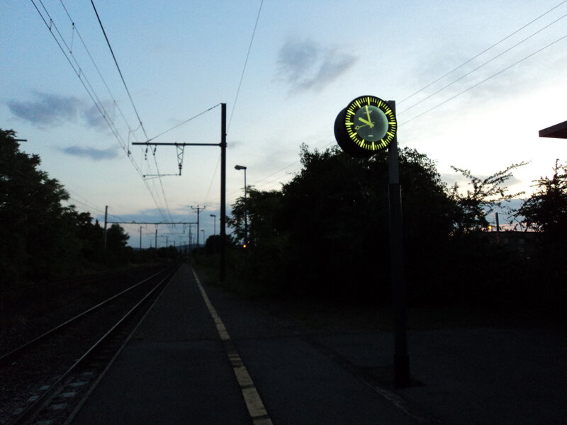 Glowing Clock at Train Station