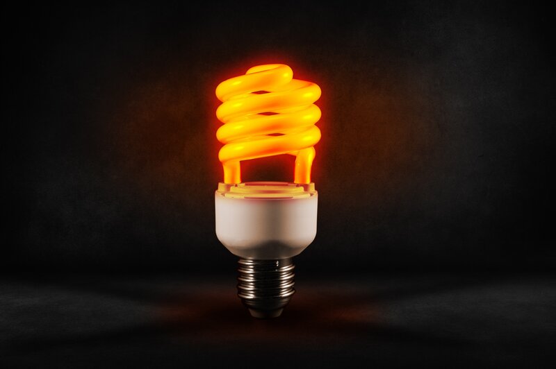 Glowing Compact Fluorescent Bulb — Yellow