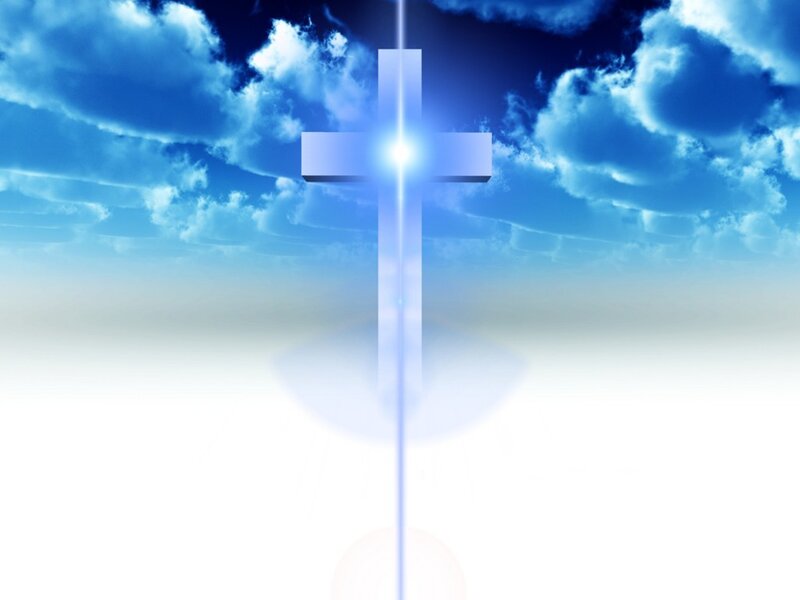 glowing cross in blue sky
