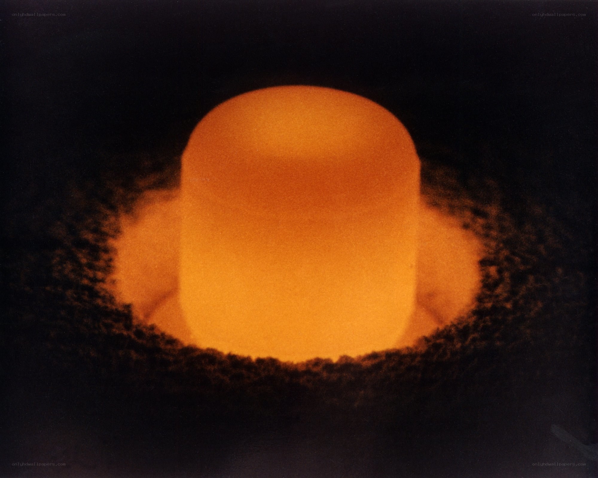Glowing cylinder in dark chamber