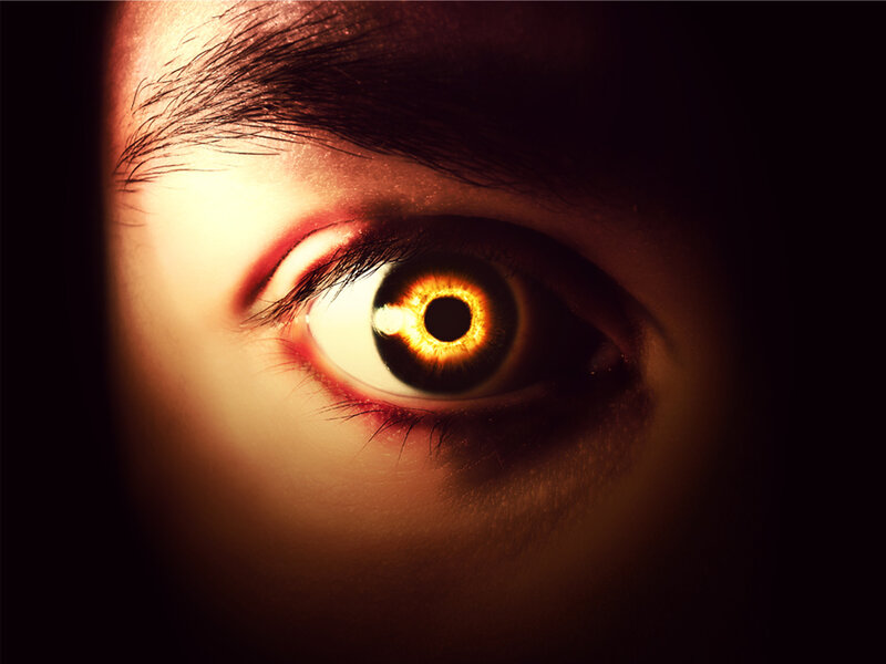 glowing eye in darkness