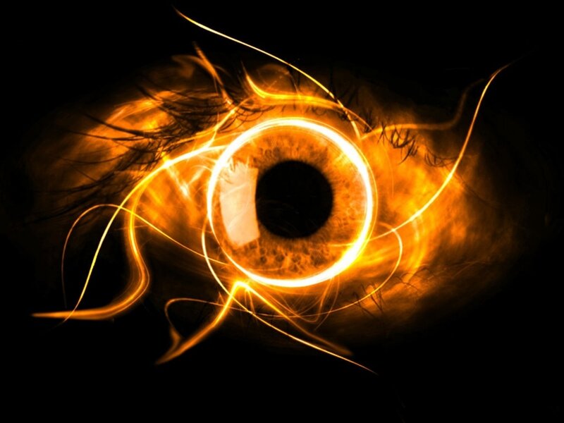 Glowing Eye with Light Trails — Orange, Dramatic