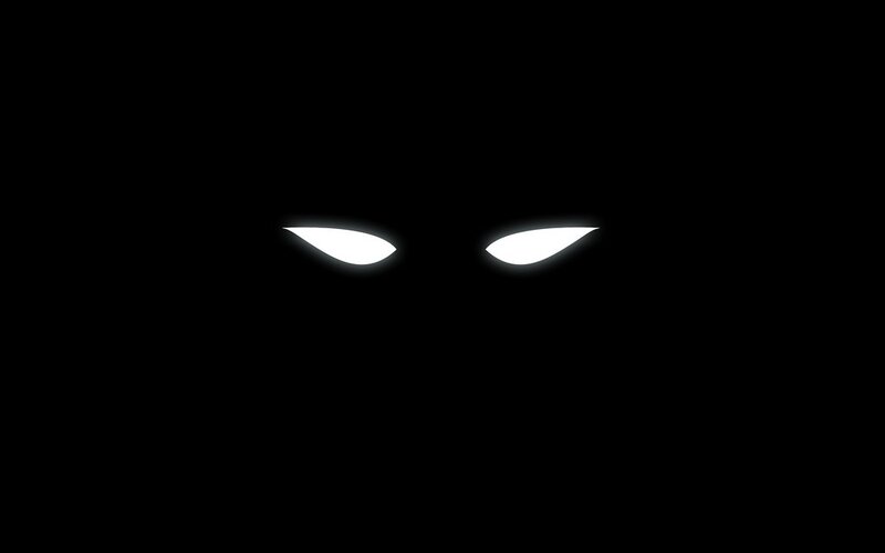 glowing eyes in darkness