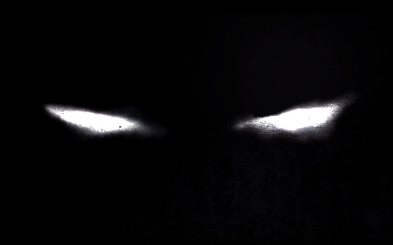 glowing eyes in darkness