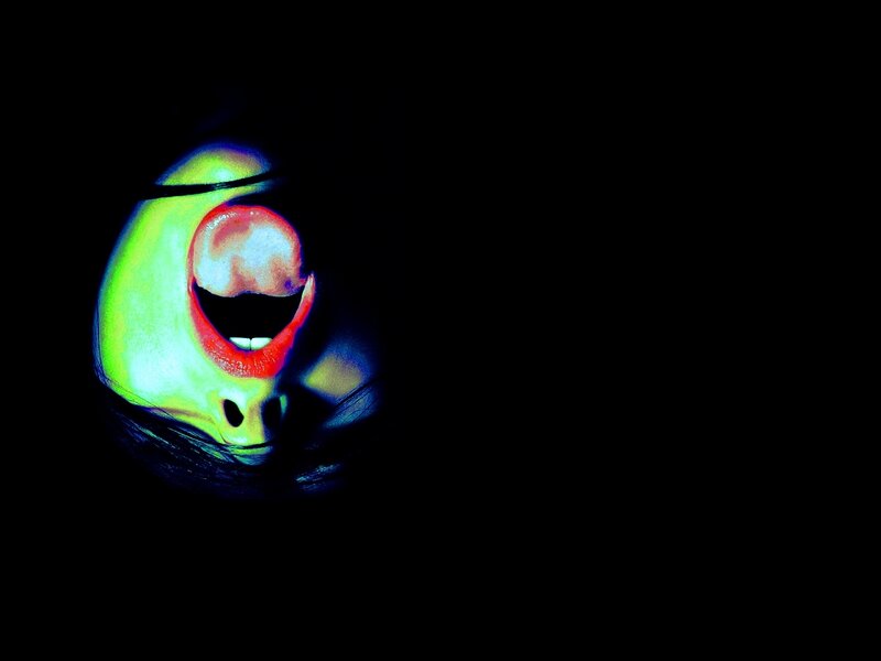 glowing face in darkness