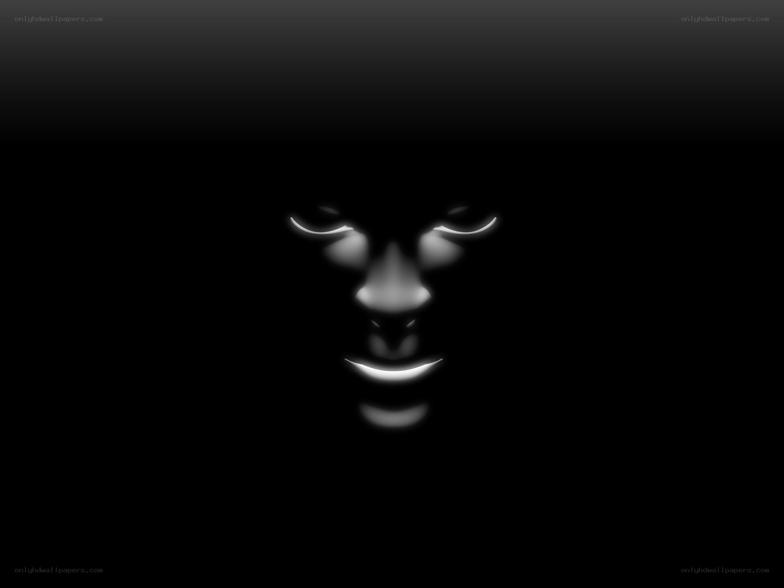 glowing face in darkness
