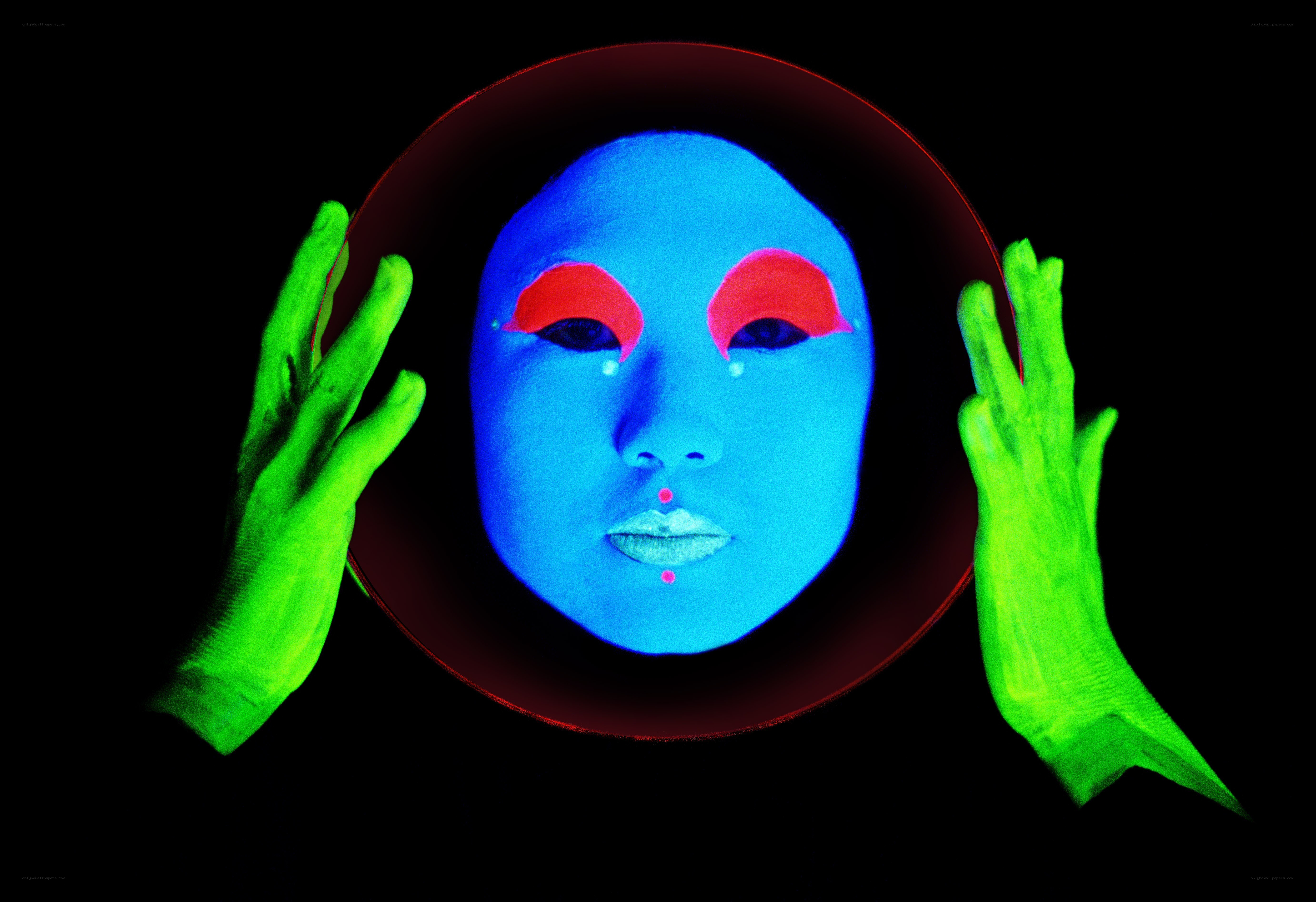 glowing face under black light